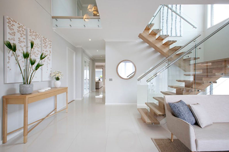 a white and glass staircase in a modern home.