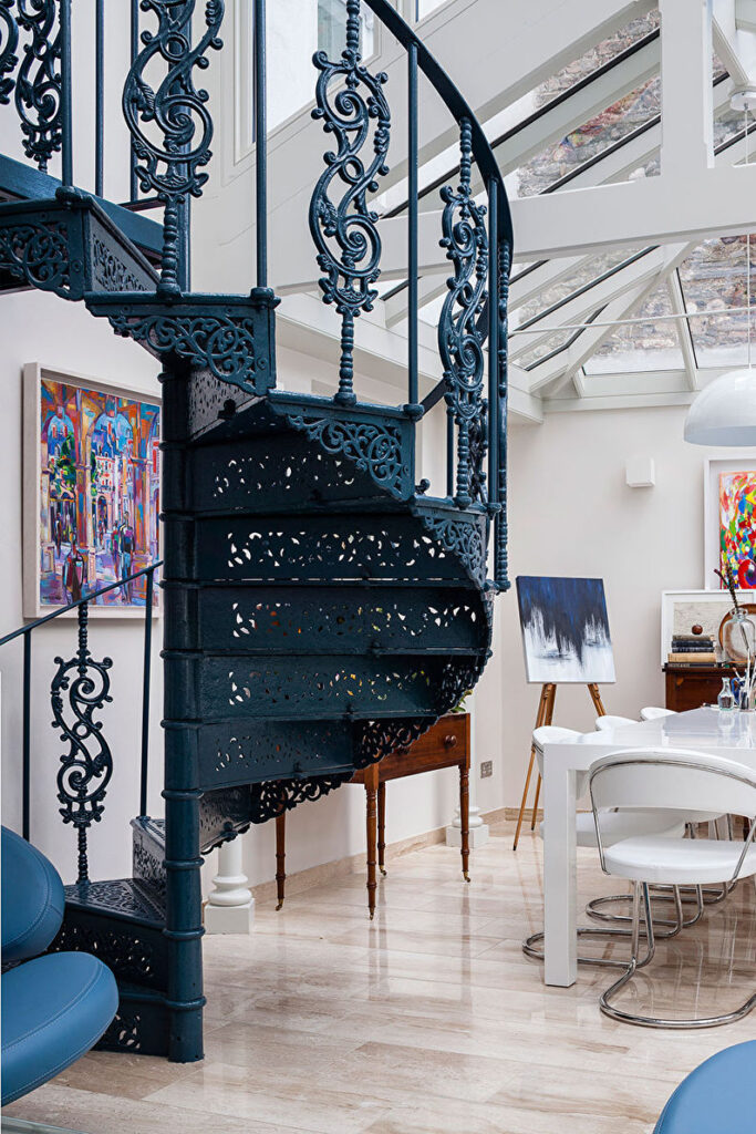 a spiral staircase in a living room.