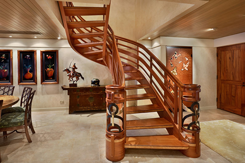 a wooden staircase leading to a dining room.