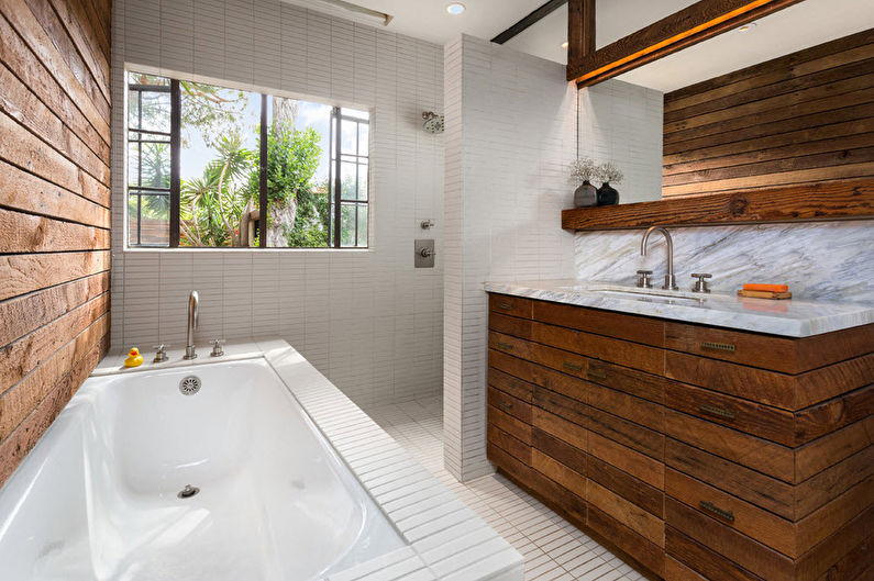 a bathroom with a wooden wall.