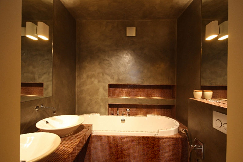 a bathroom with two sinks and a tub.