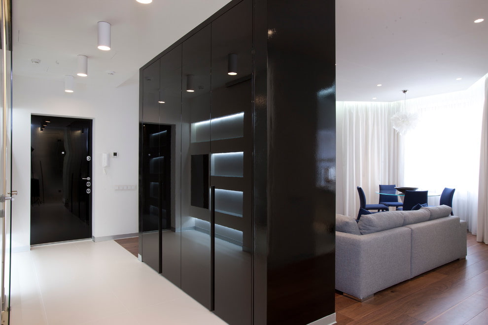 a black and white living room with a white couch.