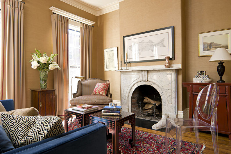 a living room with a fireplace and a blue couch.