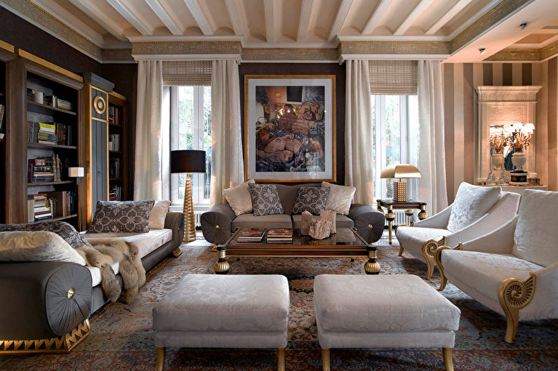 a living room decorated in gold and white.