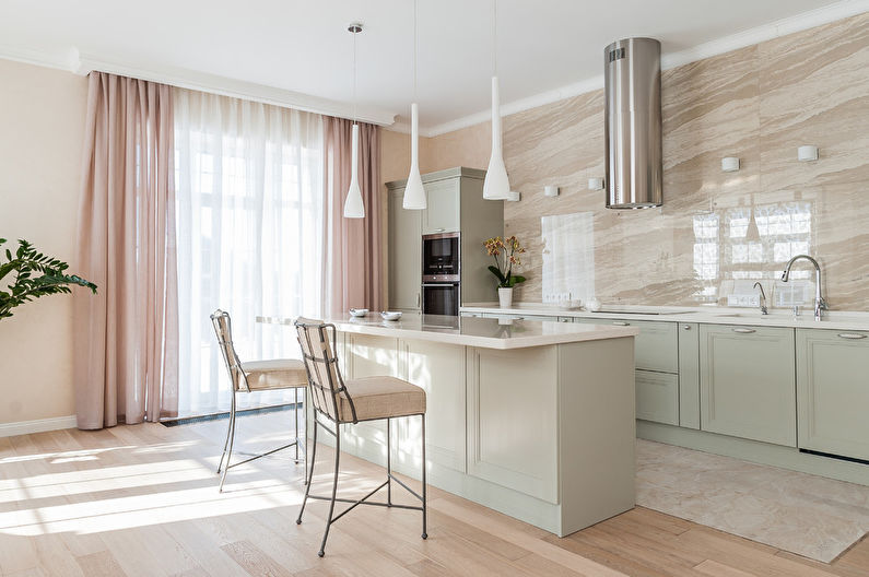 a modern kitchen with beige walls and wooden floors.