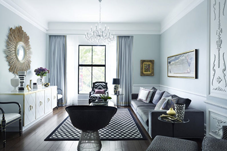 a living room with grey walls and black furniture.
