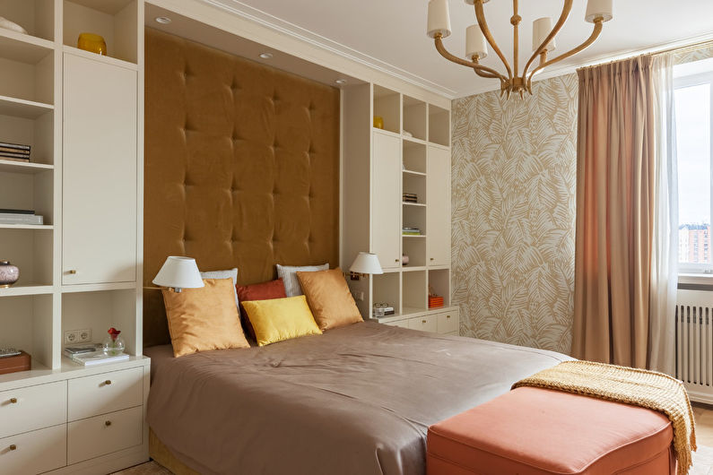 a bedroom with a bed and bookshelves.