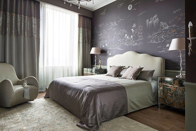 a bedroom with gray walls and a chandelier.