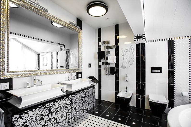 a black and white bathroom with a mirror.