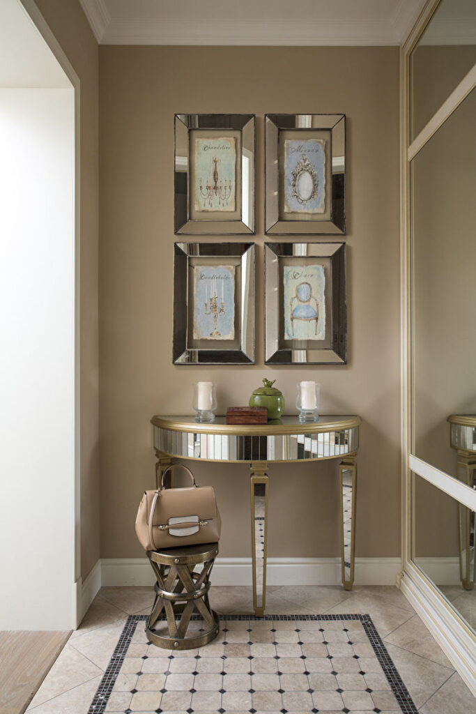 a hallway with mirrors and a table.