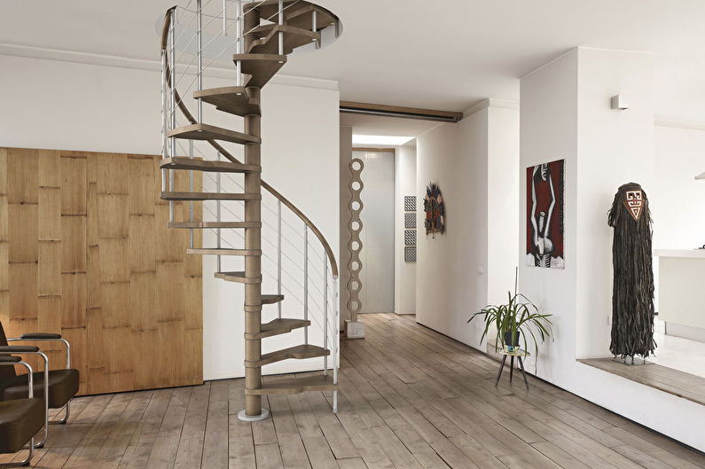 a spiral staircase in a living room.