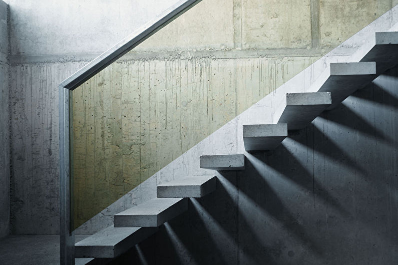 a concrete staircase in a room.