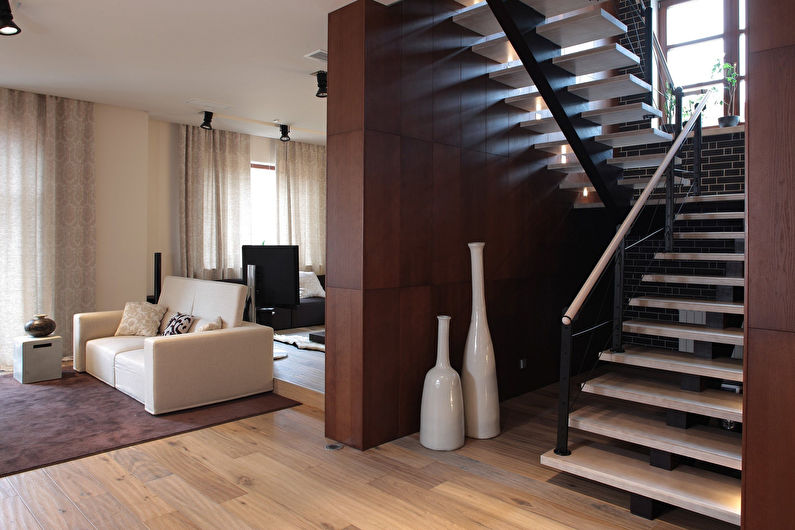 a staircase leading to a living room.