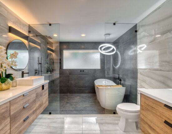 a modern bathroom with a glass shower.