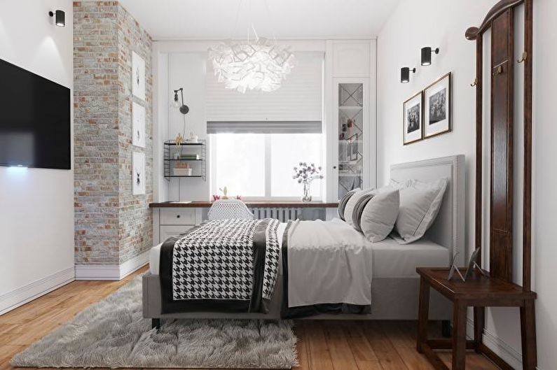 a small bedroom with white walls and a tv.