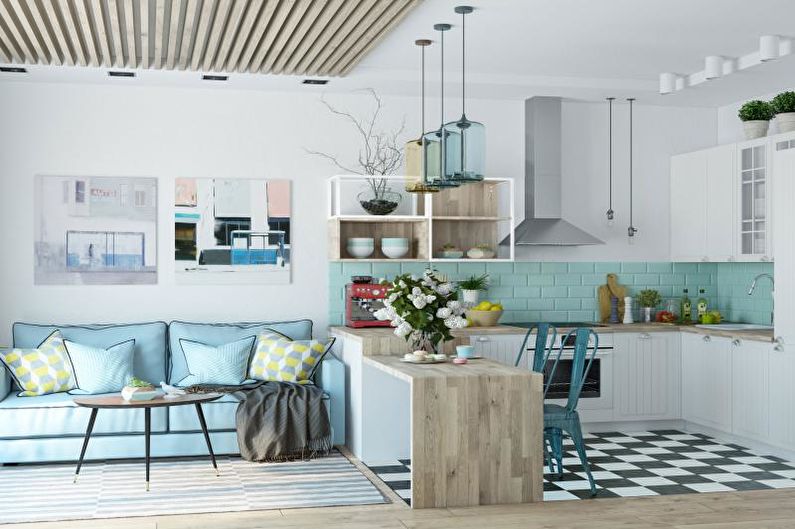 a blue and white kitchen with a checkered floor.