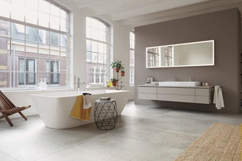 a modern bathroom with a bathtub and sink.