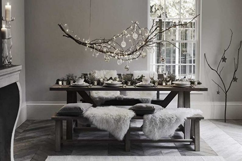 a dining room with a white table and chairs and a fireplace.