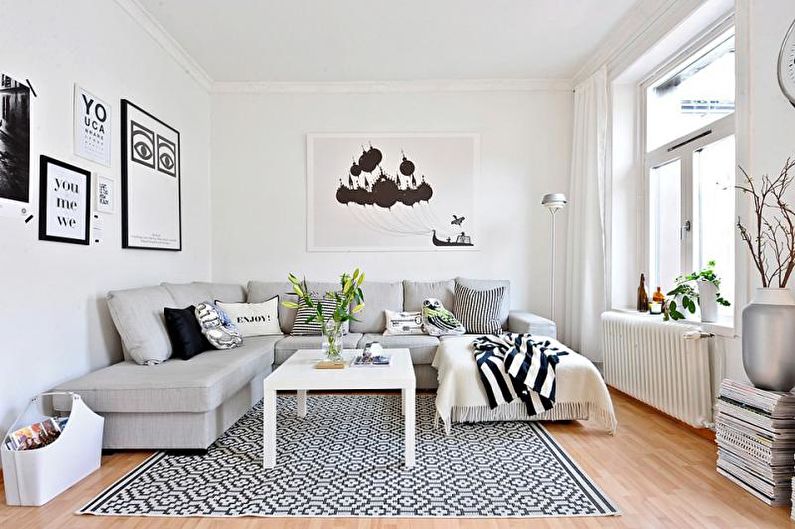 a white living room with black and white decor.