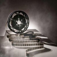 a black and white photo of a film reel.
