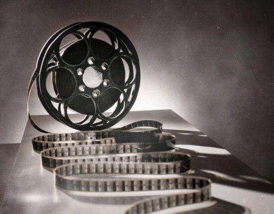 a black and white photo of a film reel.