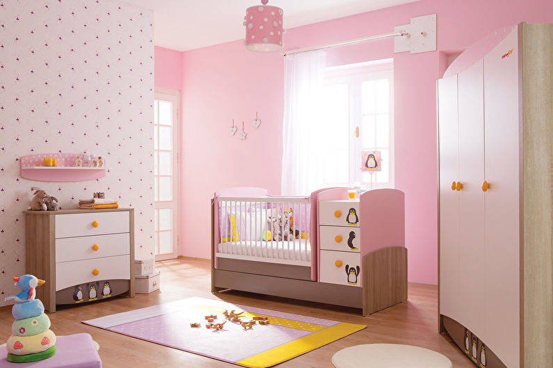 a pink and yellow baby room with a crib and dresser.