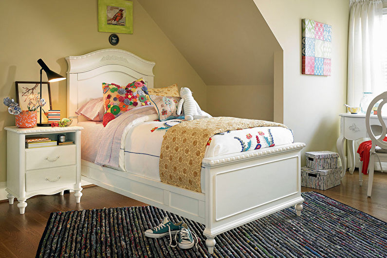 a girl's bedroom with a bed and a desk.