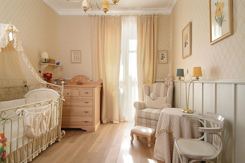 a baby's room with a crib, a dresser, and a chair.