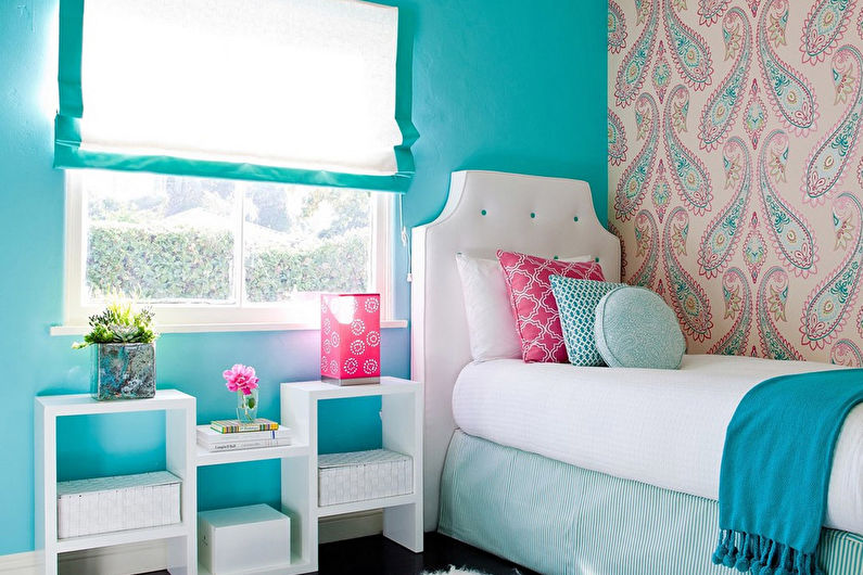 a girl's bedroom with blue walls and a white bed.