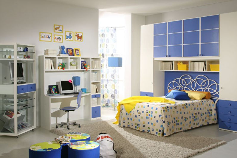 a blue and white bedroom with a bed and desk.