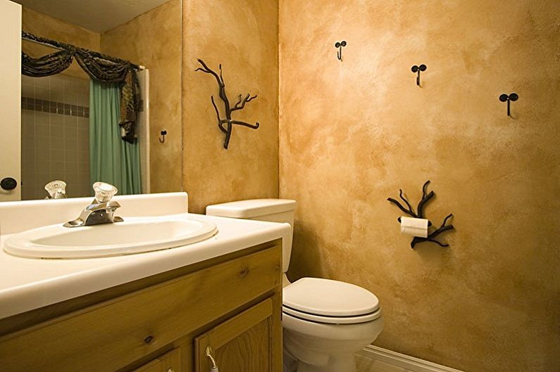 a bathroom with a toilet and sink.