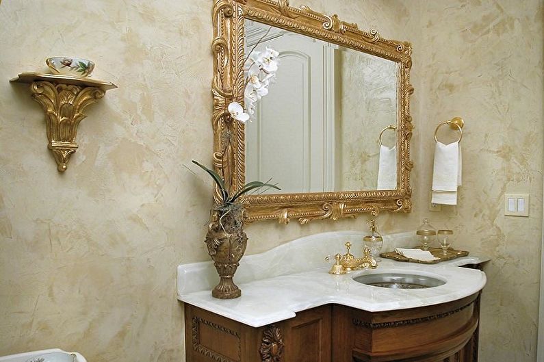 a bathroom with an ornate vanity and mirror.