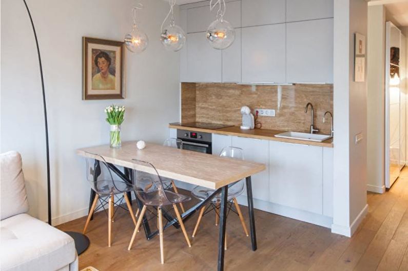 a kitchen and dining area in a small apartment.