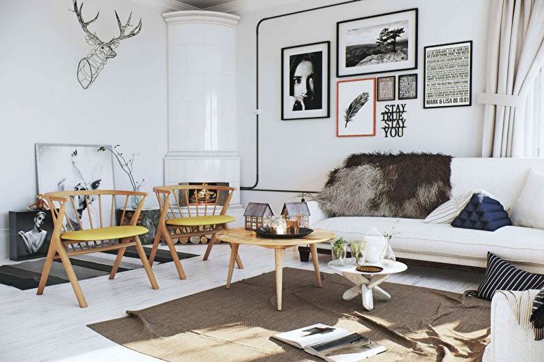 a white living room with pictures on the wall.