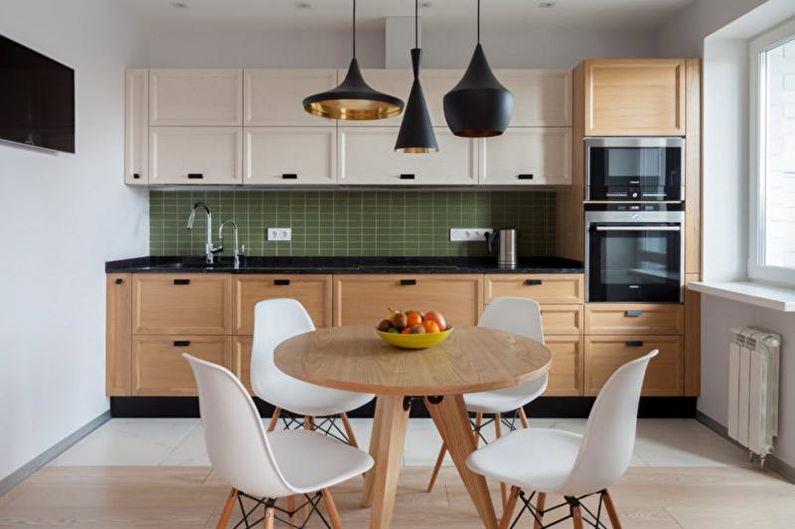 a kitchen with a wooden table and chairs.