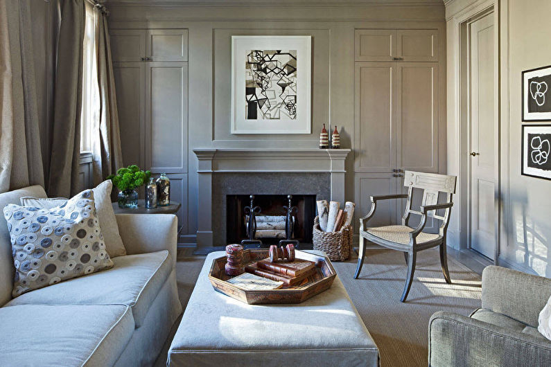 A living room with gray walls and a fireplace.