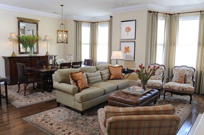 A living room with a couch and chairs.