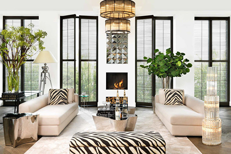 A living room with zebra print furniture and a fireplace.