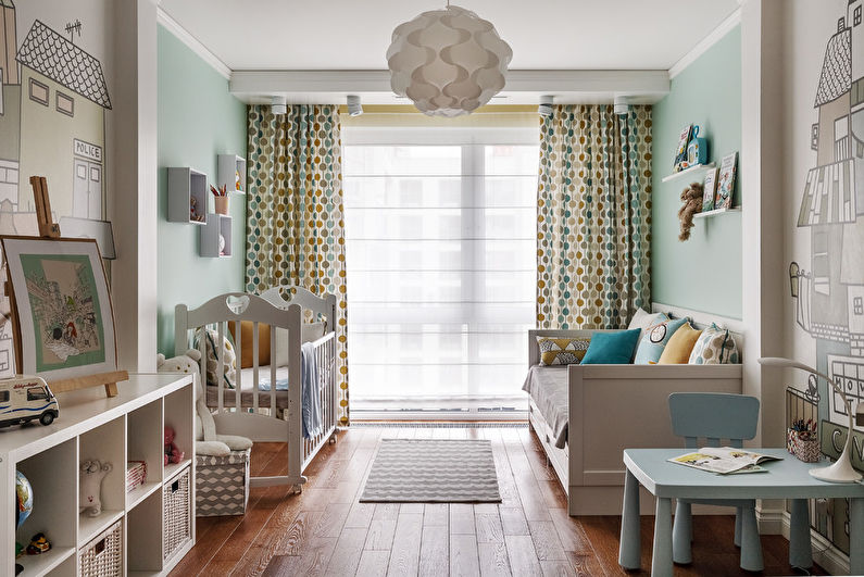 A baby's room with a wooden floor.