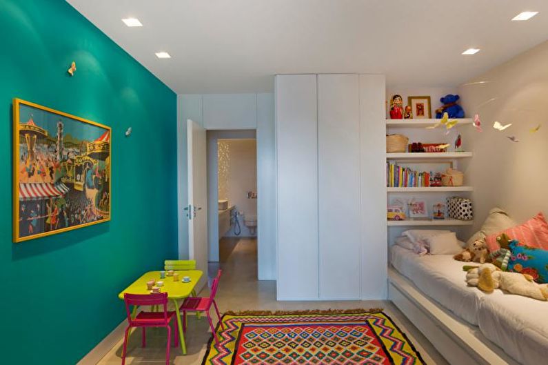 A children's room with colorful walls and a colorful rug.