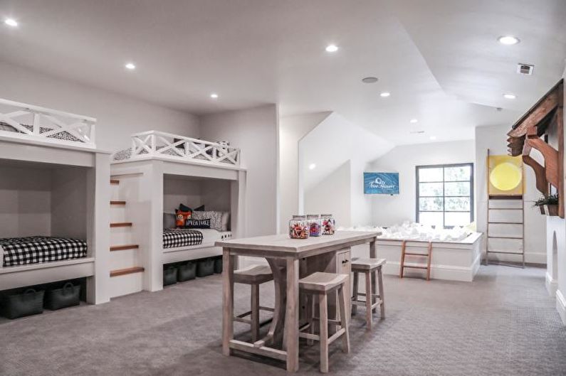 A kids room with bunk beds and a bar.