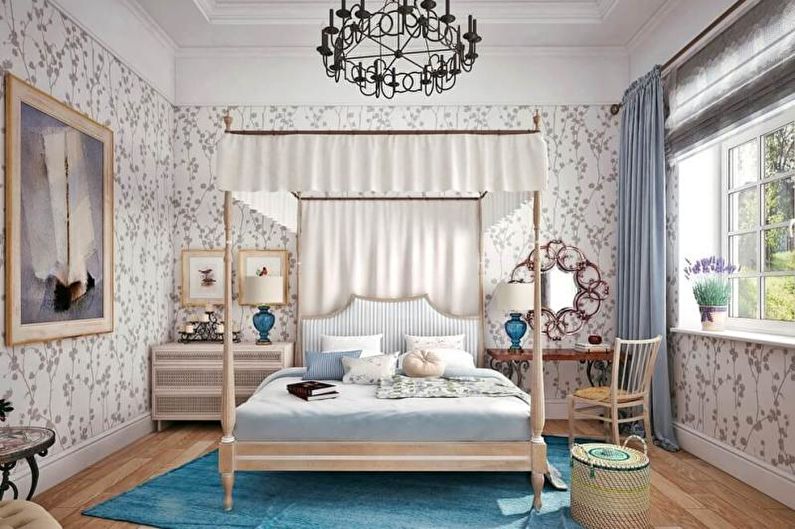 A bedroom with a four poster bed and a chandelier.