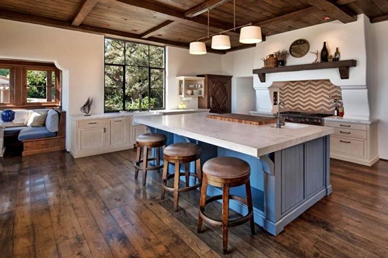 A kitchen with wood floors and a center island.