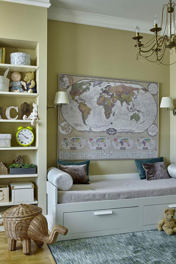 A child's room with a bed, teddy bears, and a world map.