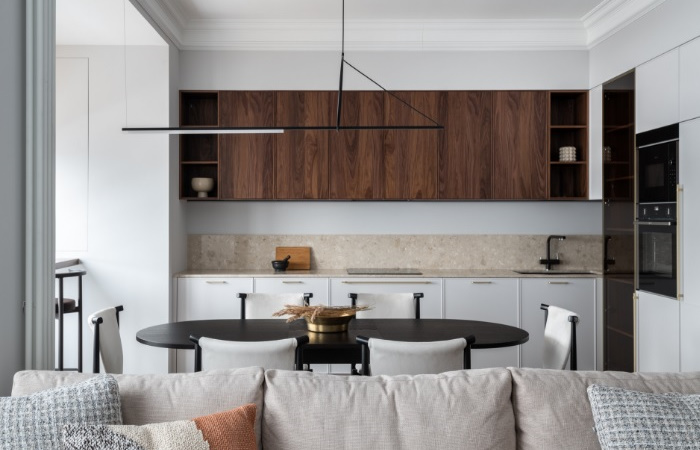 A modern kitchen and dining room in a modern apartment.