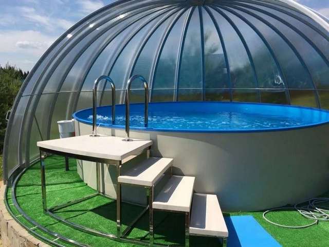 A dome with a pool inside of it.