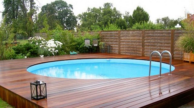 A wooden pool with a wooden deck.