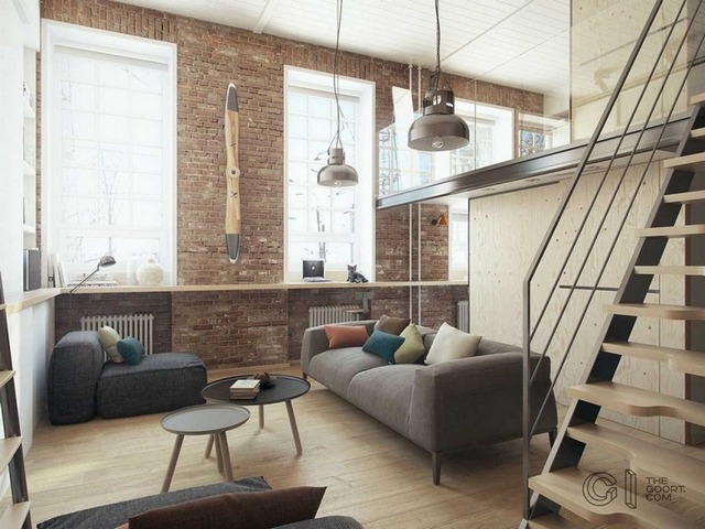 A living room with a staircase and a couch.