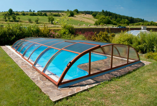 A swimming pool with a glass enclosure.