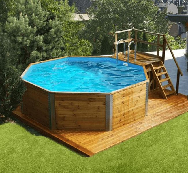 An octagonal swimming pool in a backyard.